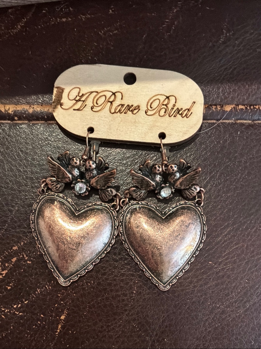 A Rare Bird Heart & Dove Drop Earrings — Distressed Brass Tone